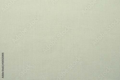 pale background fabric texture. A piece of woolen cloth is neatly laid out on the surface. Weave and textile texture. Dress fabric or for kitchen needs, tablecloth or curtains, close-up. Dash