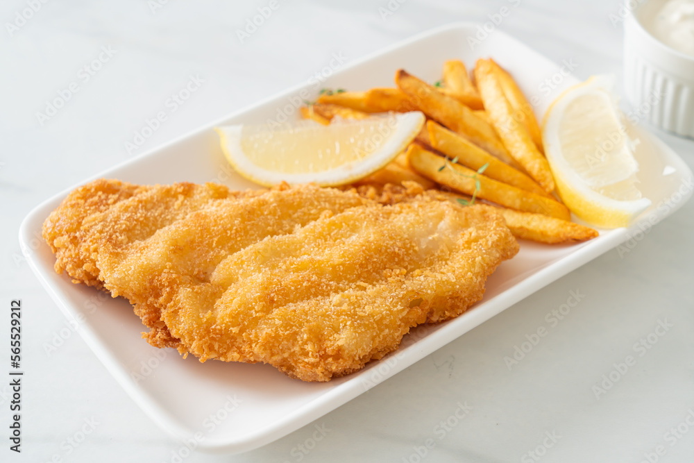 fish and chips - fried fish fillet with potatoes chips fish and chips - fried fish fillet with potatoes chips