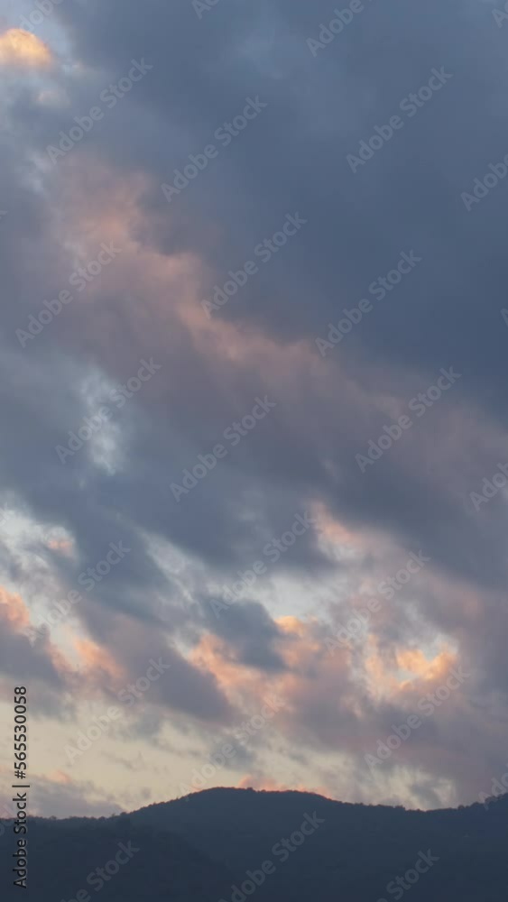 Twilight and dawn sky with cumulus cloud vertical time lapse in an evening. Twilight and dawn sky with cumulus cloud vertical time lapse in an evening.