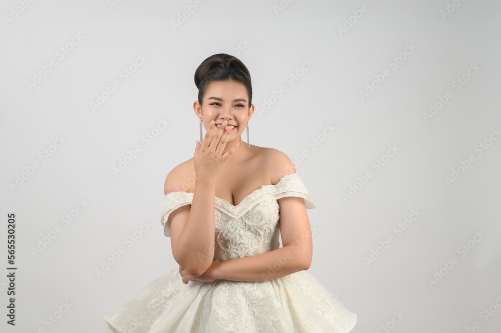 Young asian beautiful bride smiling with happy on white background Young asian beautiful bride smiling with happy on white background