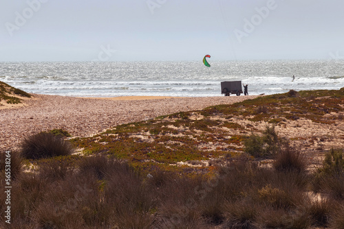 Kiteboarding on a lonely beach on the Atlantic ocean coast. Morocco.