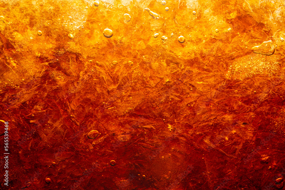 macro cola drink texture,macro soft drink texture,Close up view of ice cubes in dark cola background. Textures of sweet summer cold drinks with foam and macro bubbles on Fizzing glass wall.