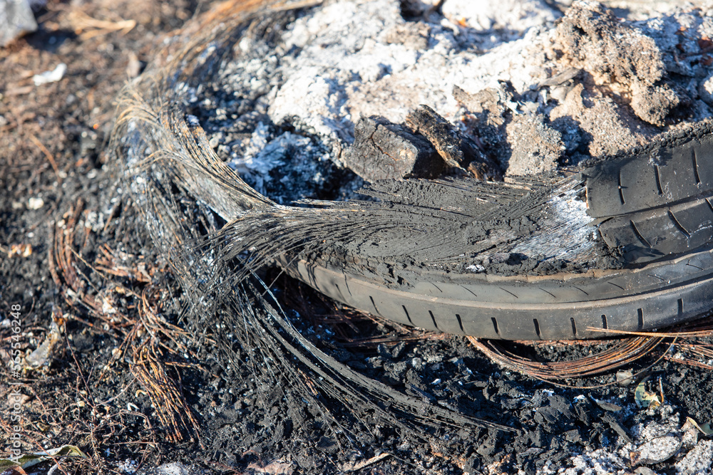 burnt car tires on the ground