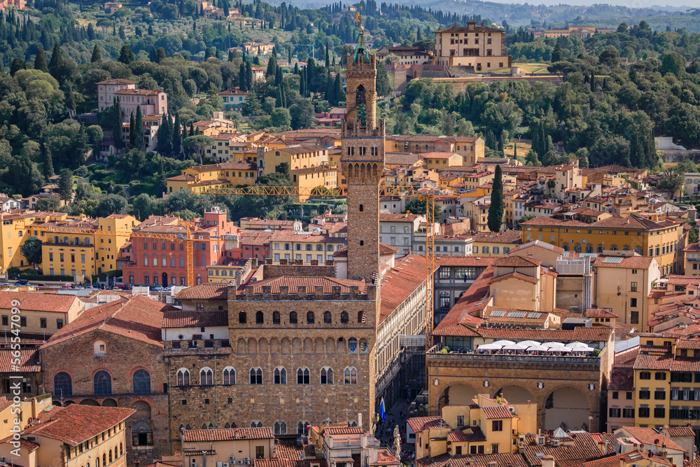 Palazzo Vecchio palace and red city rooftops in Florence, Italy, aerial view