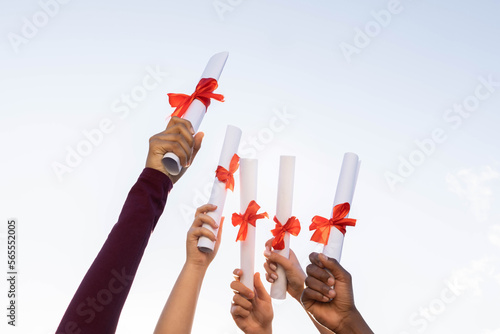 Quadro su tela Students graduation, hands and certificate in sky for success, education and future