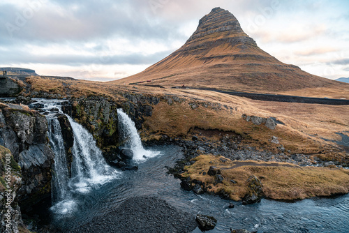 Icelandic waterfall with Kirkjufell mountain in the background