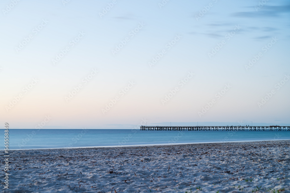 A sunset jetty in South Australia with blue tones