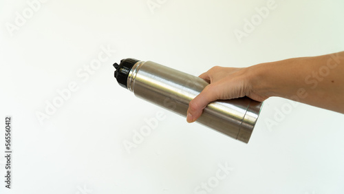 The metal thermos in your hand pours 