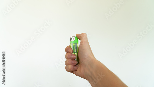 green lighter in the right hand