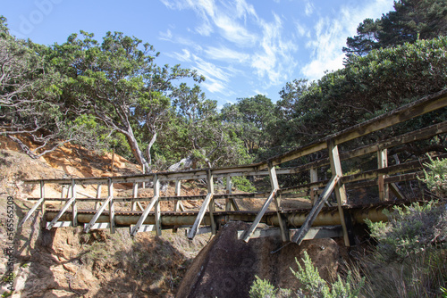 A wooden bridge over riverbed, Waihi beach to Orokawa bay track, New Zealand.