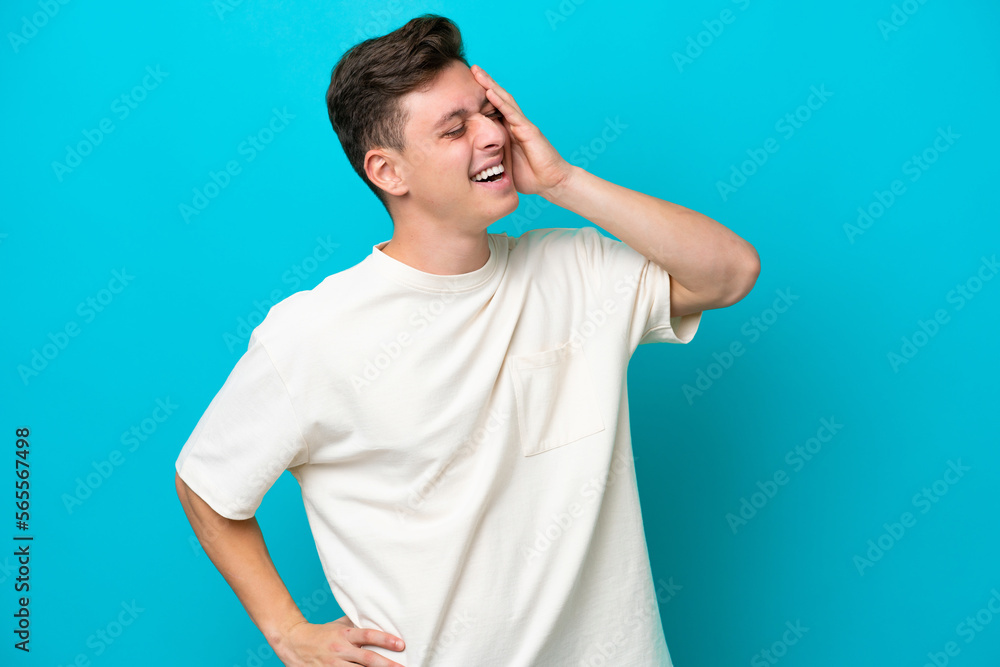 Young handsome Brazilian man isolated on blue background smiling a lot Young handsome Brazilian man isolated on blue background smiling a lot