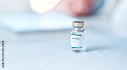 Vial, medication and drugs on table for healthcare, relief or prescription medicine for pain at the hospital. Bottle or container of painkiller, vaccine or pharmaceutical liquid to combat illness