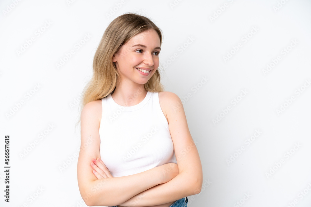 Blonde English young girl isolated on white background with arms crossed and happy Blonde English young girl isolated on white background with arms crossed and happy