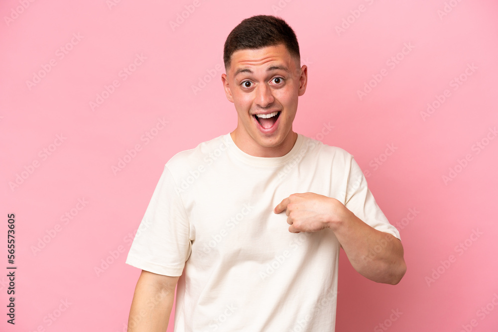 Young Brazilian man isolated on pink background with surprise facial expression Young Brazilian man isolated on pink background with surprise facial expression