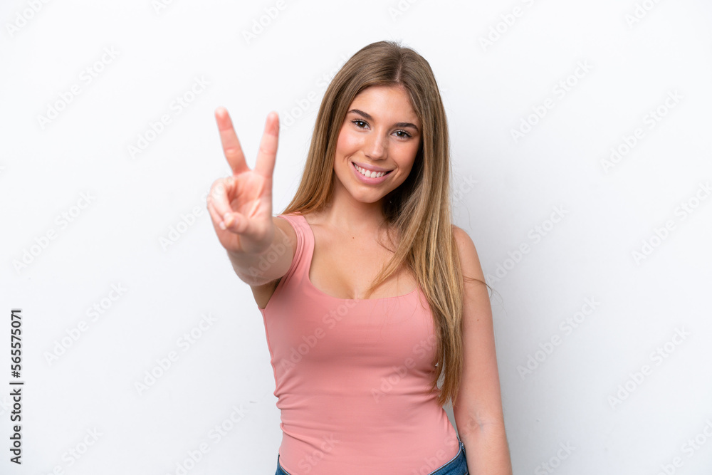 Young caucasian woman isolated on white bakcground smiling and showing victory sign Young caucasian woman isolated on white bakcground smiling and showing victory sign