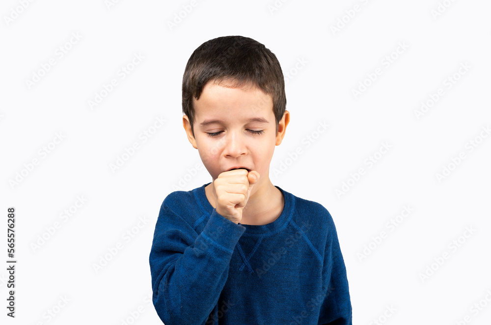 Young little boy kid wearing blue shirt standing over isolated background feeling unwell and coughing as symptom for cold or bronchitis. Young little boy kid wearing blue shirt standing over isolated background feeling unwell and coughing as symptom for cold or bronchitis.