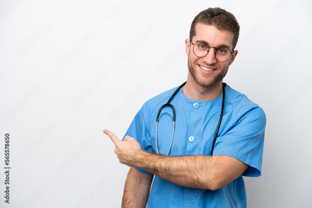 Young surgeon doctor caucasian man isolated on white background pointing back Young surgeon doctor caucasian man isolated on white background pointing back
