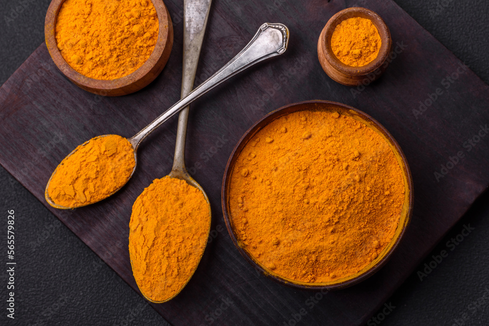 Bright yellow turmeric or curry spice for Asian food preparation Bright yellow turmeric or curry spice for Asian food preparation
