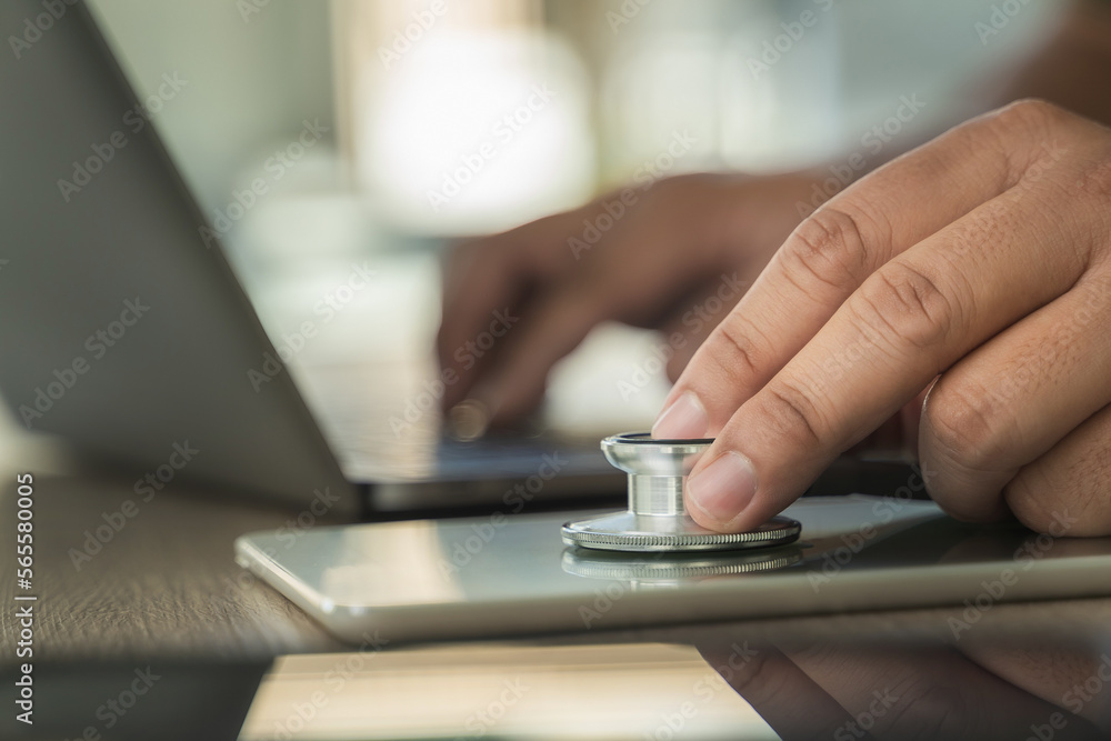 Fototapeta premium stethoscope computer and background doctor using laptop at desk medical network on Computing electronic medical