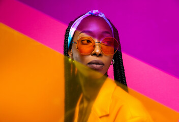 Beautiful african american woman with afro pigtails hairstyle and stylish clothes - Portrait of young black girl in studio, creative portrait with fashionable style in studio