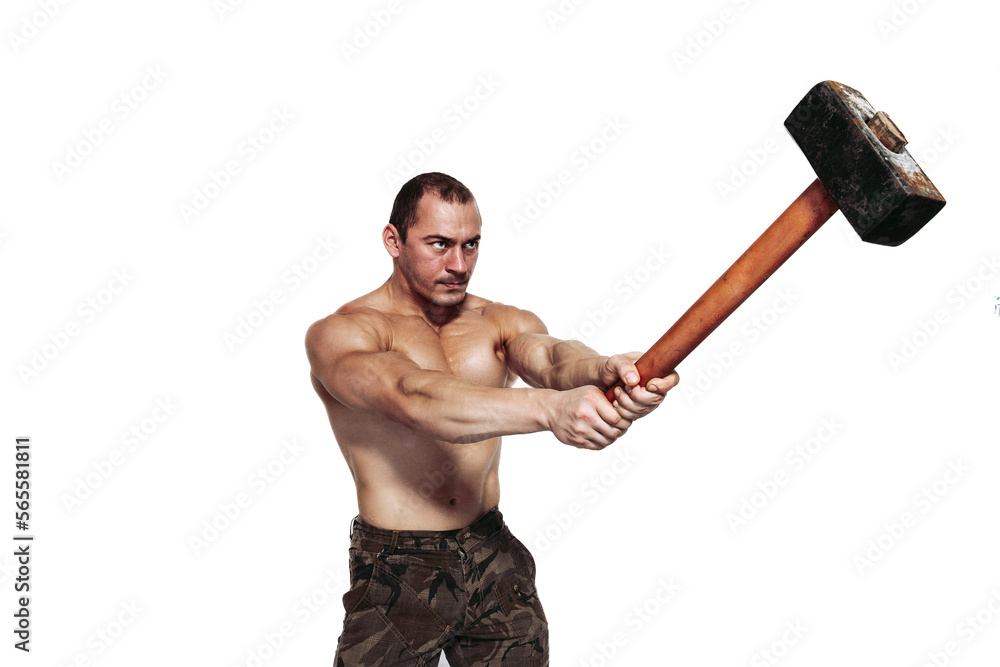 Strong brutal man with naked torso who strikes with sledgehammer while isolated on white background Strong brutal man with naked torso who strikes with sledgehammer while isolated on white background
