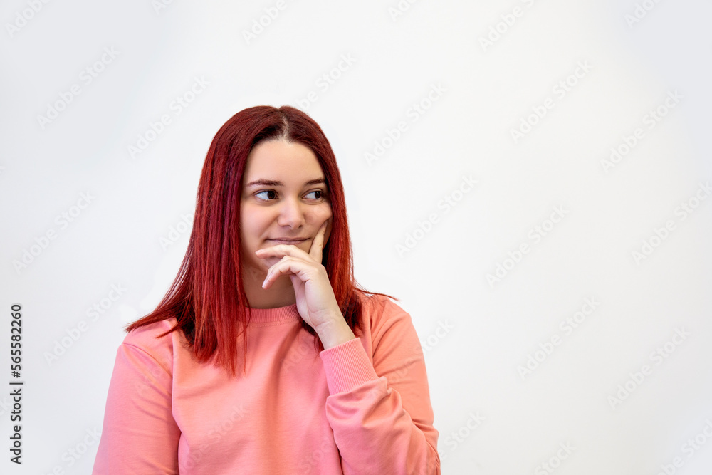 Young woman is thinking on white background Young woman is thinking on white background