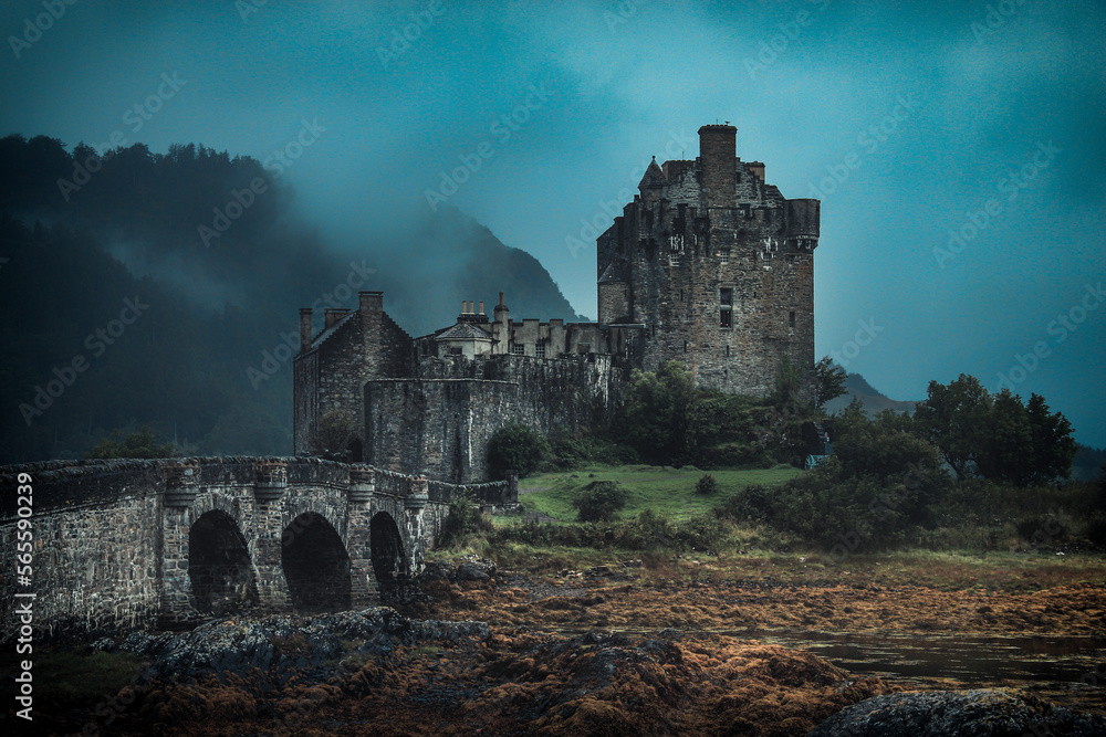 Eilean Donan Castle with dark clouds and fogs in gloomy days Eilean Donan Castle with dark clouds and fogs in gloomy days