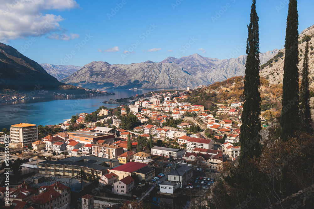 Kotor, Montenegro, process of climbing to the top of San Giovanni Fortress, Fort St. John, old medieval town, hiking on the Ladder of Kotor, sunny day with a blue sky and mount Lovcen and Orjen