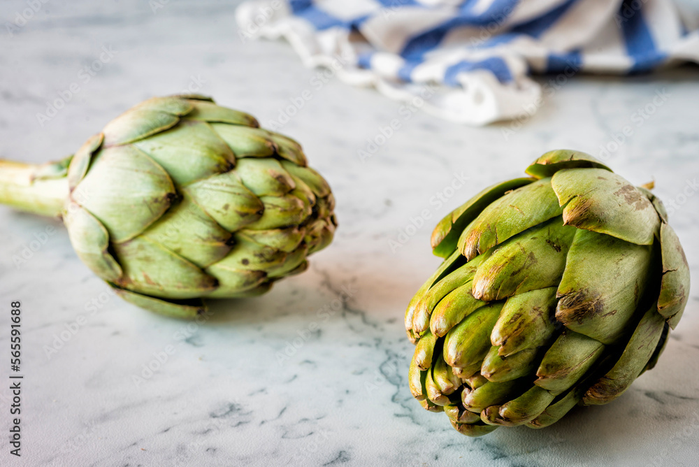 Artichokes on a marble counter Artichokes on a marble counter
