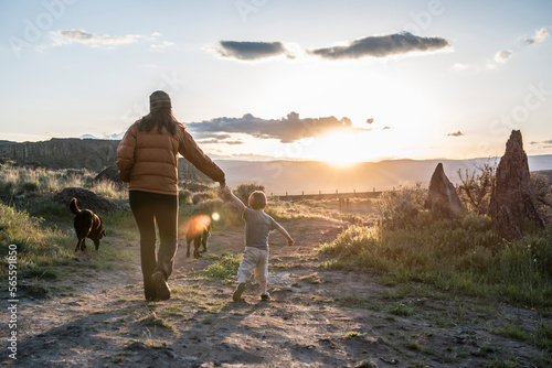 A mother and child hike at sunset in Eastern Washington. photo