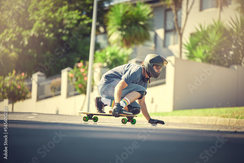 Skateboard, street and mock up with a sports man skating or training outdoor while moving at speed for action. Fitness, exercise and road with a male skater or athlete outside to practice his balance