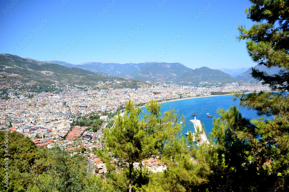 Alanya town with mediterranean sea, sea port, mountains and pine trees, viewpoint
