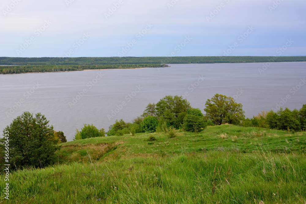 Volga river with island in the middle in cloudy day, view from the hill