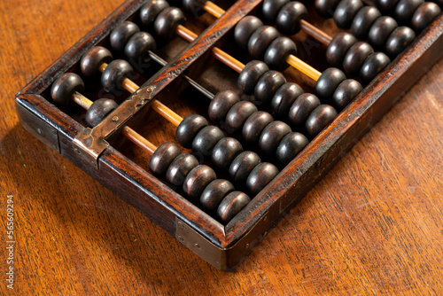 Vintage Wooden Chinese Abacus on a wooden table