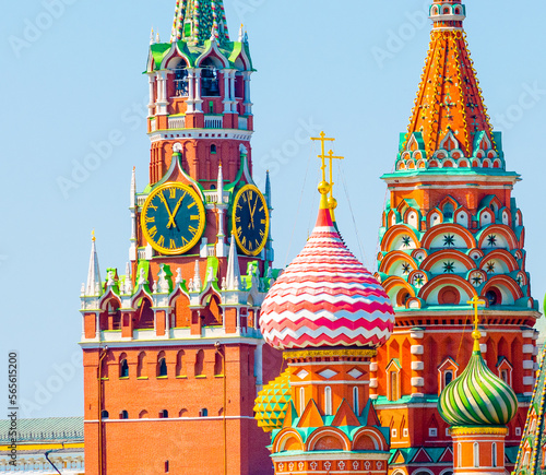 Spasskaya Tower of Moscow Kremlin and domes of the Cathedral of Vasily the Blessed (Saint Basil's Cathedral) on Red Square in summer day. Close up. Moscow. Russia