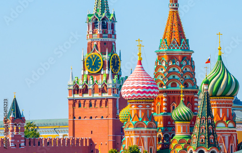 Spasskaya Tower of Moscow Kremlin and domes of the Cathedral of Vasily the Blessed (Saint Basil's Cathedral) on Red Square in sunny summer day. Moscow. Russia