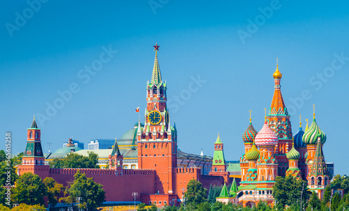 Spasskaya Tower of Moscow Kremlin and Cathedral of Vasily the Blessed (Saint Basil's Cathedral) on Red Square in summer sunny day. Panorama. Moscow. Russia
