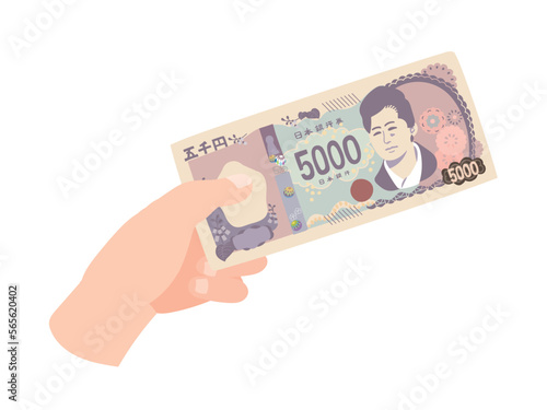 新五千円札を持つ手