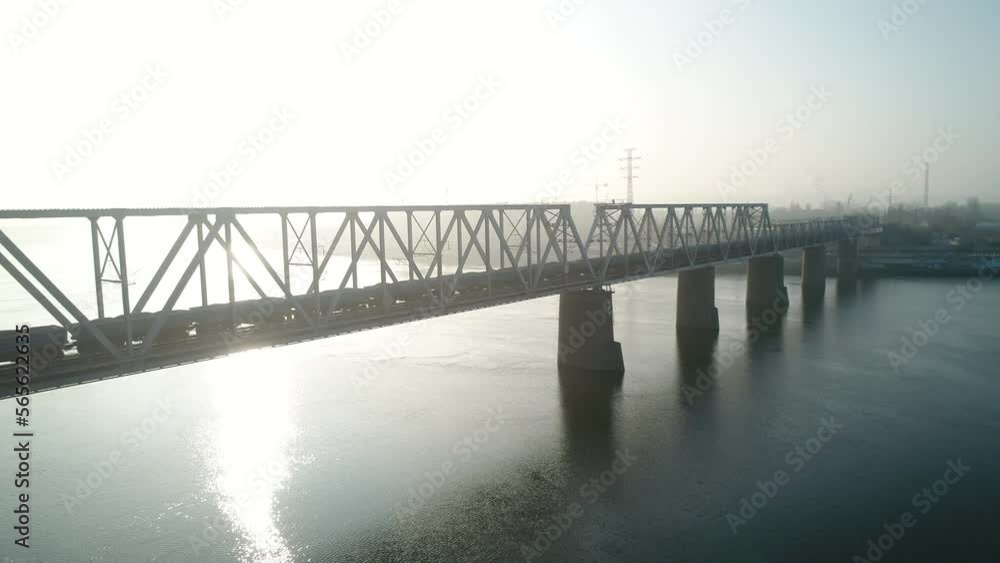 Petrovsky railway bridge over the Dnieper River, Ukraine, Kyiv city. Drone video. Autumn. Fog. Petrovsky railway bridge over the Dnieper River, Ukraine, Kyiv city. Drone video. Autumn. Fog.