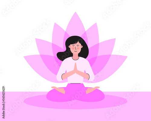 Yoga, meditation and mindfulness concept. Beautiful woman sitting on yoga mat, sukhasana pose with pink lotus flower behind her. Young female smiling, crossed legs position, palms and hands touching.