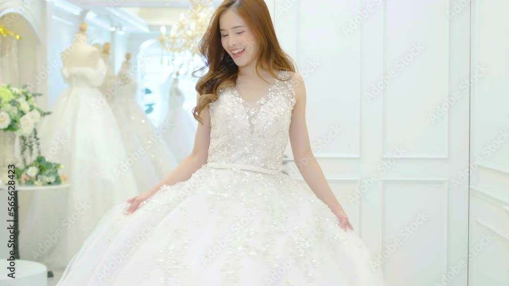 Beautiful bride turning around in white dress. Happy woman in wedding day posing, enjoying the celebration, Happy woman in wedding day theme concept, enjoying the celebration. Beautiful bride turning around in white dress. Happy woman in wedding day posing, enjoying the celebration, Happy woman in wedding day theme concept, enjoying the celebration.