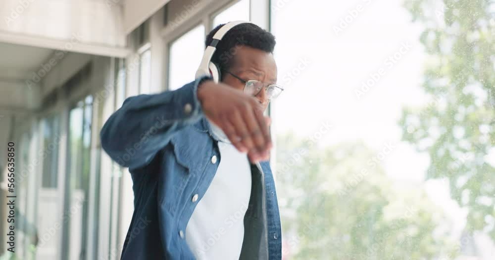 Office, headphones and business black man dance with energy, happy attitude and positive mindset. Motivation, celebration and male dancing listening to music, audio and radio in creative workplace Office, headphones and business black man dance with energy, happy attitude and positive mindset. Motivation, celebration and male dancing listening to music, audio and radio in creative workplace