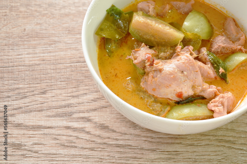spicy boiled slice chicken and eggplant in coconut milk red curry soup on bowl spicy boiled slice chicken and eggplant in coconut milk red curry soup on bowl