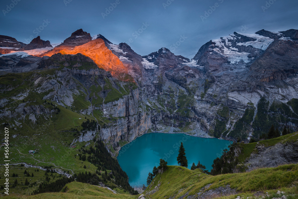 The high peaks around Lake Oeschinen during a dramatic sunset, Swiss Alps, Bernese Oberland, Switzerland