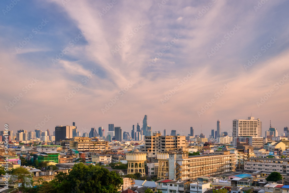 Fototapeta premium Cityscape of Bangkok city center in sunset, blue sky and clouds