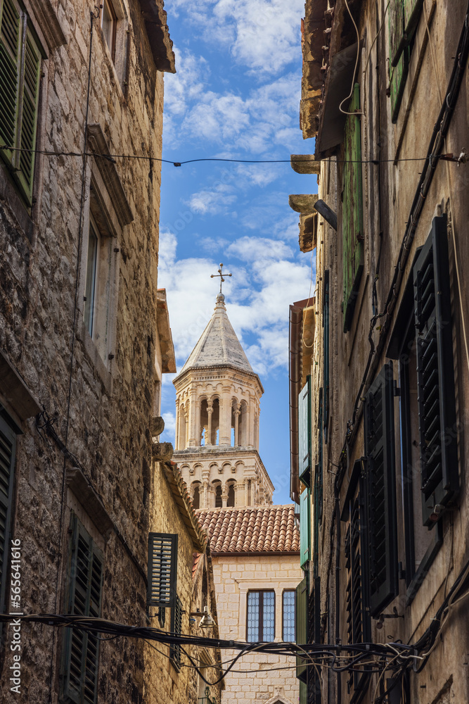 A narrow alley in Diocletian's Palace in Split with the cathedral in the background A narrow alley in Diocletian's Palace in Split with the cathedral in the background