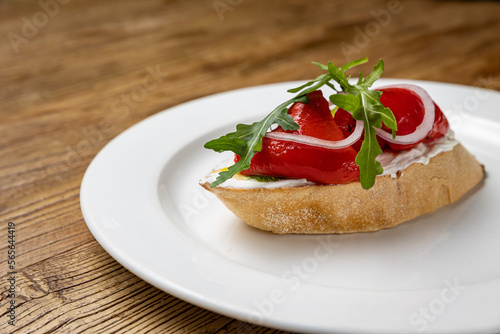 delicious bruschetta with baked pepper and cheese 