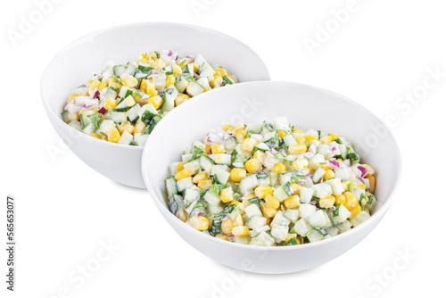 Cucumber corn salad in a bowl on a white isolated background