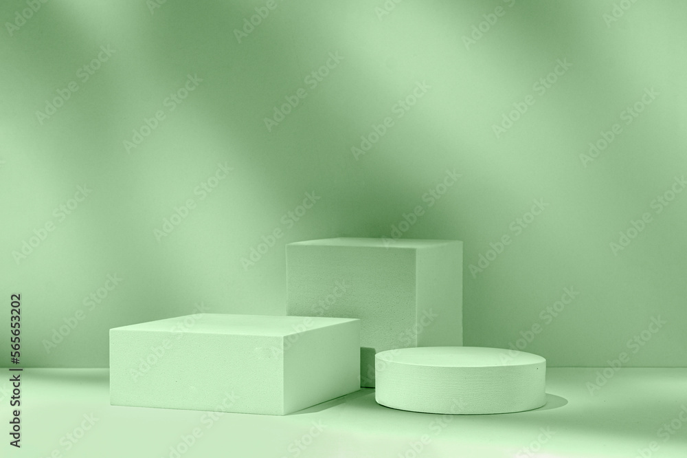 Background with runway blocks for advertising the product on a green background with shadows and light. High quality photo Background with runway blocks for advertising the product on a green background with shadows and light. High quality photo