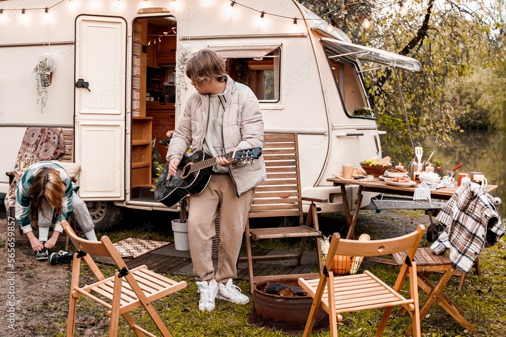 Children,family,brother sister traveling in camper,house on wheels. Trailer motor home.Looking in window. Funny road travel.Campsite van overnight.Wanderlust vacation,weekend.Girl,guy,happy adventure Children,family,brother sister traveling in camper,house on wheels. Trailer motor home.Looking in window. Funny road travel.Campsite van overnight.Wanderlust vacation,weekend.Girl,guy,happy adventure
